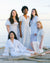 Simple Chic Women Diverse Women all Wearing White Clothing on the Beach